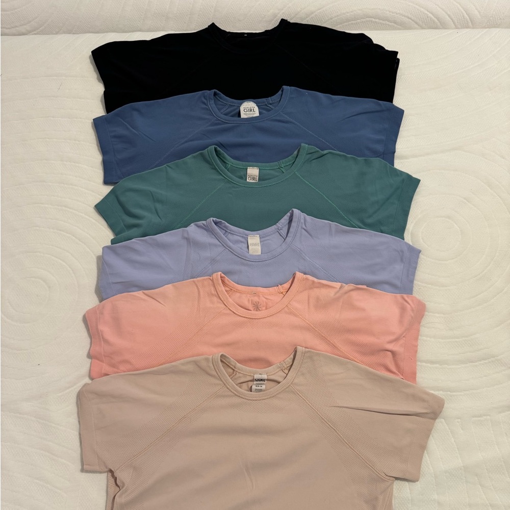 Athleta Girl Power Up Tees. Size 8-10. Blk, blue, pink, purple, peach. $22 each
